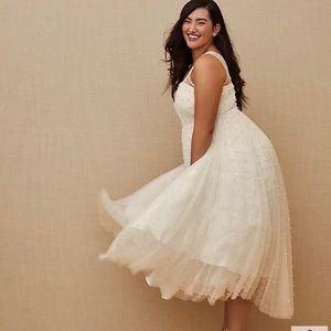 Torrid Ever After tea length wedding dress. Ivory with pearl embellishment.